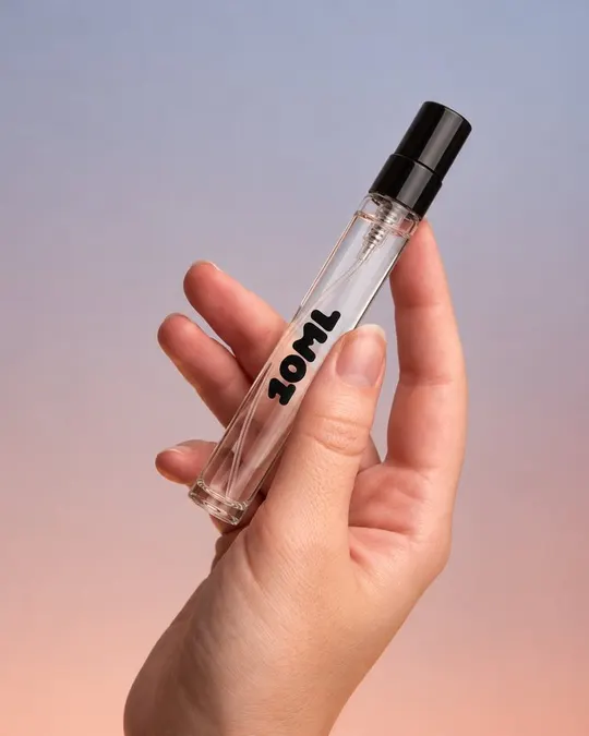 A 10ML 3ml spray vial held between two fingers